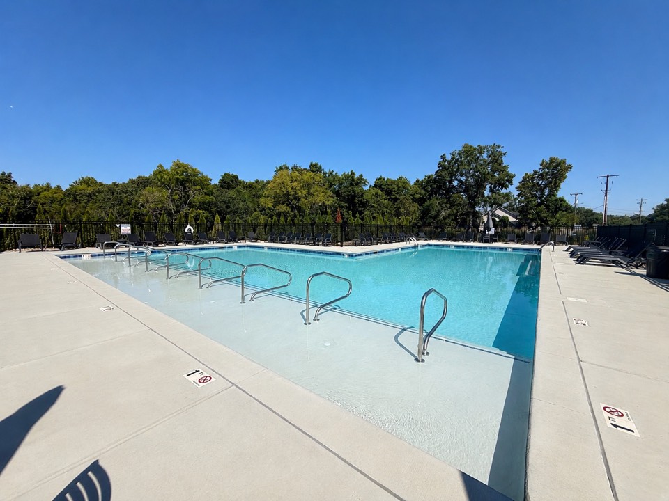 Canebrake community swimming pool with lounge chairs and a shallow entry area